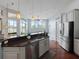 Modern kitchen with stainless steel appliances and an island with seating at 2622 Bonterra Blvd, Valrico, FL 33594