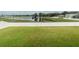 Large backyard with grassy area and white vinyl fence at 2622 Bonterra Blvd, Valrico, FL 33594
