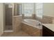Spa-like bathroom with a soaking tub and shower at 2622 Bonterra Blvd, Valrico, FL 33594