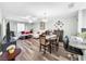 Spacious living room and dining area with wood-look flooring at 2920 Star Apple Ct, Palm Harbor, FL 34684