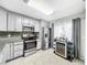 Updated kitchen featuring stainless steel appliances and granite countertops at 2920 Star Apple Ct, Palm Harbor, FL 34684