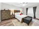 Cozy bedroom with wood-look flooring and plenty of natural light at 2920 Star Apple Ct, Palm Harbor, FL 34684