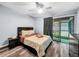 Bright bedroom with sliding door to patio access at 2920 Star Apple Ct, Palm Harbor, FL 34684