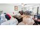 Open living room showcasing a comfortable sectional sofa and wood flooring at 2920 Star Apple Ct, Palm Harbor, FL 34684