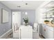 Cozy dining area with modern light fixture, banquette seating, and built-in bar at 345 Bayshore Blvd # 1104, Tampa, FL 33606