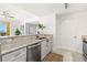 Well-lit kitchen with granite countertops, stainless steel appliances, and easy access to other living spaces at 345 Bayshore Blvd # 1104, Tampa, FL 33606
