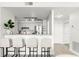 Bright kitchen area features modern cabinets and stainless steel appliances, open to the living area with bar seating at 345 Bayshore Blvd # 1104, Tampa, FL 33606