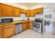 Kitchen with wood cabinets and stainless steel appliances at 4715 Bay Ne St # 227, St Petersburg, FL 33703