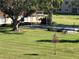 Outdoor shuffleboard court nestled under a shaded pergola at 4915 Bay Ne St # 122, St Petersburg, FL 33703