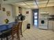 Kitchen features white cabinets and tiled flooring at 4915 Bay Ne St # 122, St Petersburg, FL 33703