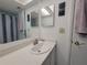 Bathroom with vanity, sink, mirror, and shower with striped curtain at 4915 Bay Ne St # 122, St Petersburg, FL 33703