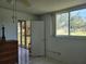 Bedroom with dresser, ceiling fan, and sliding glass doors to patio at 4915 Bay Ne St # 122, St Petersburg, FL 33703