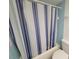 Bathroom with shower/tub, striped shower curtain, and toilet at 4915 Bay Ne St # 122, St Petersburg, FL 33703