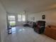 Bright living room with tiled floors and comfortable seating at 4915 Bay Ne St # 122, St Petersburg, FL 33703