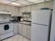 Well-equipped kitchen with white appliances at 4915 Bay Ne St # 122, St Petersburg, FL 33703