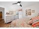 Cozy bedroom with floral bedding, wood floors, and dresser at 910 Oakwood Dr, Largo, FL 33770