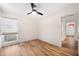 Inviting bedroom with wood floors, white walls, and lots of natural light at 910 Oakwood Dr, Largo, FL 33770