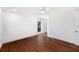 Light-filled bedroom with wood floors, white walls, and a modern ceiling fan at 910 Oakwood Dr, Largo, FL 33770