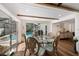 Bright dining room with views of the pool and outdoor area at 910 Oakwood Dr, Largo, FL 33770