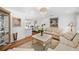 A bright living room featuring neutral furnishings, beautiful decor, and wood flooring at 910 Oakwood Dr, Largo, FL 33770