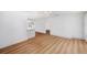 Bright living room featuring wood floors, white walls, and an open floor plan at 910 Oakwood Dr, Largo, FL 33770