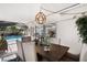 Enclosed lanai with dining area and view of pool at 910 Oakwood Dr, Largo, FL 33770