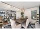 Inviting outdoor dining area with contemporary furniture and decor, with seamless access to the interior at 910 Oakwood Dr, Largo, FL 33770