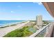 Ocean view from condo balcony showcasing beach and tennis courts at 1310 Gulf Blvd # 11B, Clearwater Beach, FL 33767