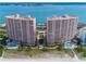 Aerial view of two beachfront condo buildings with pools and ocean views at 1310 Gulf Blvd # 11B, Clearwater Beach, FL 33767