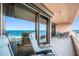 Condo balcony with relaxing chairs and ocean view at 1310 Gulf Blvd # 11B, Clearwater Beach, FL 33767