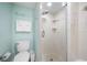 Small bathroom with walk-in shower and updated fixtures at 1310 Gulf Blvd # 11B, Clearwater Beach, FL 33767