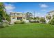 Backyard with a large grassy area and a newly constructed fence at 1015 Snell Isle Ne Blvd, St Petersburg, FL 33704