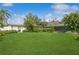 Expansive grassy backyard, featuring a large covered patio area at 1015 Snell Isle Ne Blvd, St Petersburg, FL 33704