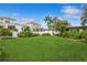 Large backyard with a spacious grassy area and lush landscaping at 1015 Snell Isle Ne Blvd, St Petersburg, FL 33704