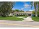 House exterior showcasing a ranch style home with a lawn at 1015 Snell Isle Ne Blvd, St Petersburg, FL 33704