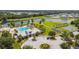 Resort-style community pool with a clubhouse and playground at 12743 Rainwashed Loop, Parrish, FL 34219