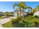 One car garage with landscaping and driveway at 12743 Rainwashed Loop, Parrish, FL 34219