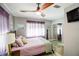 Main bedroom with a queen bed and soft, neutral tones at 130 63Rd S St, St Petersburg, FL 33707