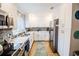 Modern kitchen with white cabinets and updated appliances at 130 63Rd S St, St Petersburg, FL 33707