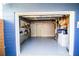 Clean and organized garage with epoxy flooring and storage at 130 63Rd S St, St Petersburg, FL 33707