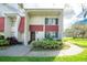 Two-story townhome with red accents at 1827 Pine Cone Cir, Clearwater, FL 33760