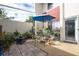 Outdoor patio with seating area and abundant potted plants at 1827 Pine Cone Cir, Clearwater, FL 33760