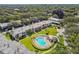 Aerial view showcasing community pool and surrounding buildings at 1827 Pine Cone Cir, Clearwater, FL 33760