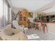 Bright sunroom with wicker furniture and access to patio at 1827 Pine Cone Cir, Clearwater, FL 33760