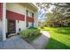 Townhome entrance with walkway and landscaping at 1827 Pine Cone Cir, Clearwater, FL 33760