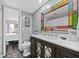 Updated bathroom with a modern vanity and mosaic tile floor at 1827 Pine Cone Cir, Clearwater, FL 33760