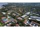 Aerial view of community, highlighting location near water at 1827 Pine Cone Cir, Clearwater, FL 33760