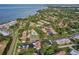 Community overview featuring numerous condos, pool, and tennis court at 1827 Pine Cone Cir, Clearwater, FL 33760