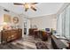 Home office with wood desk, chest and hardwood floors at 1827 Pine Cone Cir, Clearwater, FL 33760