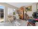 Relaxing sunroom with wicker furniture and backyard access at 1827 Pine Cone Cir, Clearwater, FL 33760